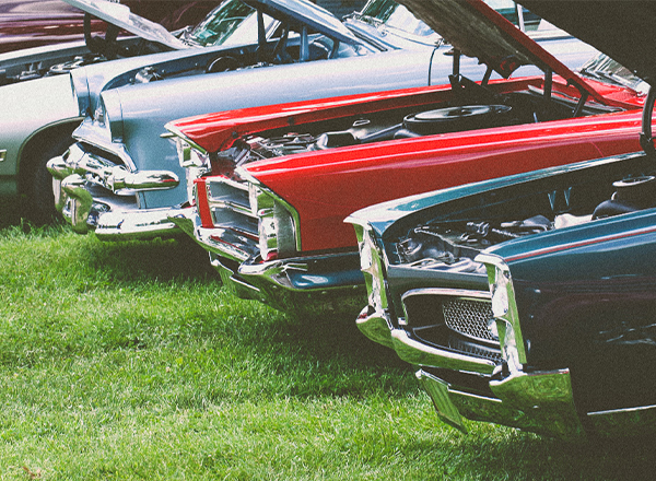 cars lined up at a car show