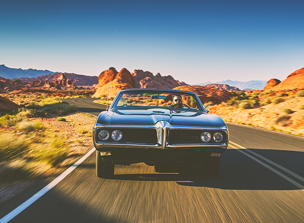 classic car front view on open road